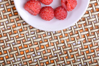 Big Pile of Fresh Raspberries in the White Bowl