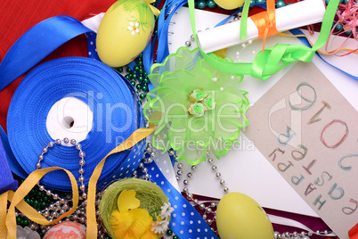 Easter background with eggs, ribbons and spring decoration