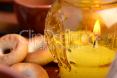 candles in glass burning romantic celecration concept wooden kitchen close up
