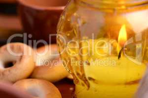 candles in glass burning romantic celecration concept wooden kitchen close up