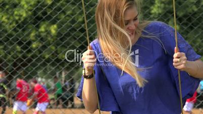 Teen Girl Swinging At Playground