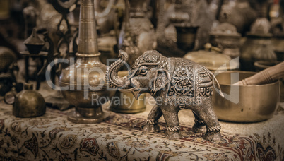 Detailed close-up elephant figurine made of metal.