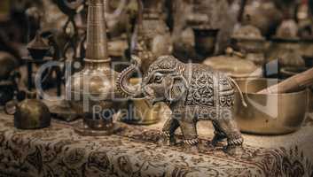 Detailed close-up elephant figurine made of metal.