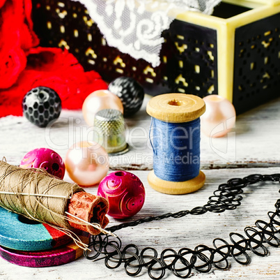 Jewelry and a sewing tool