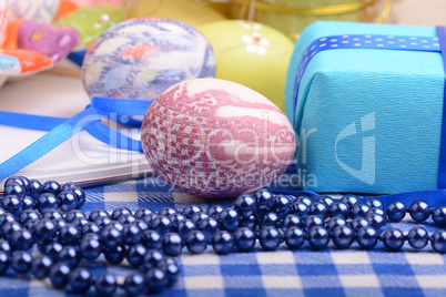 Assorted Easter coloured eggs in the paper egg box