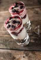 Muesli and yogurt with cranberries and raspberry .