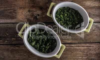 parsley on wood in the dish