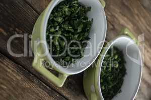 Parsley on wooden board .