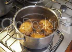 Boiling potato in saucepan