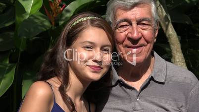 Teen Girl Smiling With Grandfather