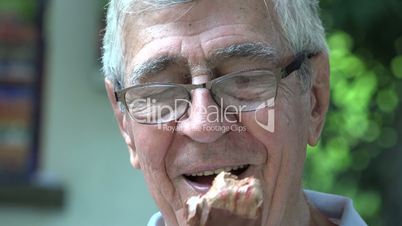 Happy Elderly Man Eating Popsicle
