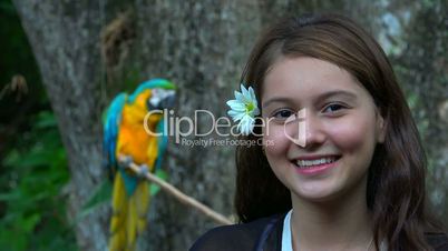 Smiling Teen Girl And Parrot