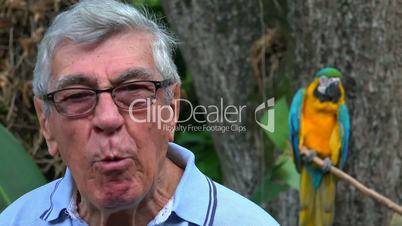 Silly Senior Man With Parrot