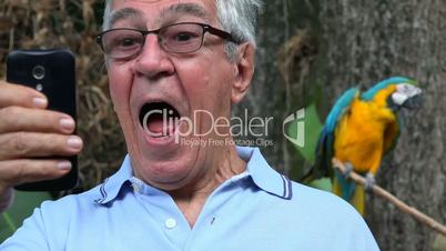 Elderly Man Selfie With Parrot