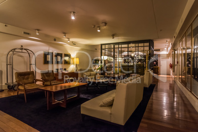 Lobby of hotel with chairs and tables