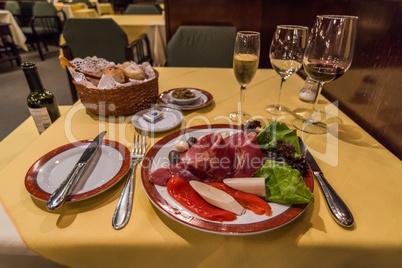 Plate of antepasto on table in restaurant