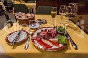 Plate of antepasto on table in restaurant