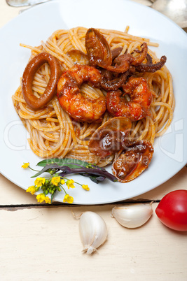 Italian seafood spaghetti pasta on red tomato sauce