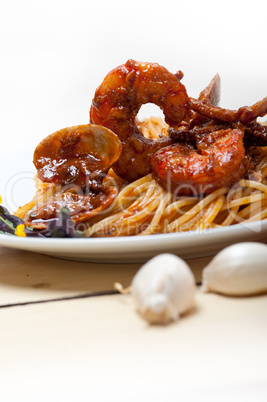 Italian seafood spaghetti pasta on red tomato sauce