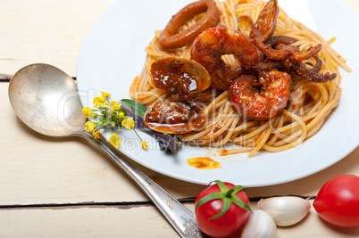 Italian seafood spaghetti pasta on red tomato sauce