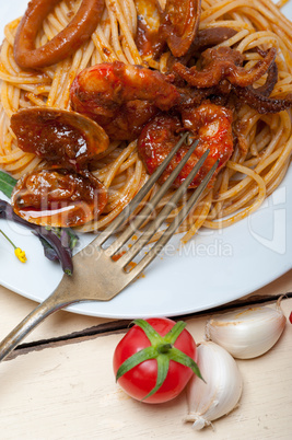 Italian seafood spaghetti pasta on red tomato sauce