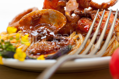 Italian seafood spaghetti pasta on red tomato sauce