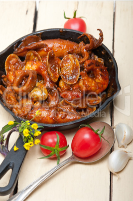 fresh seafoos stew on an iron skillet