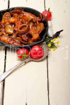 fresh seafoos stew on an iron skillet