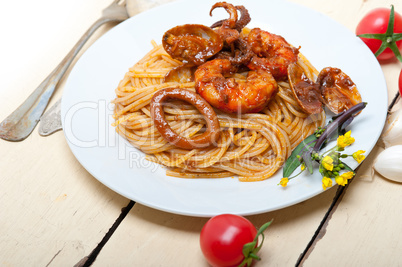 Italian seafood spaghetti pasta on red tomato sauce