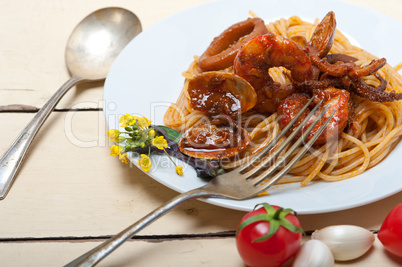 Italian seafood spaghetti pasta on red tomato sauce