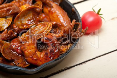 fresh seafoos stew on an iron skillet