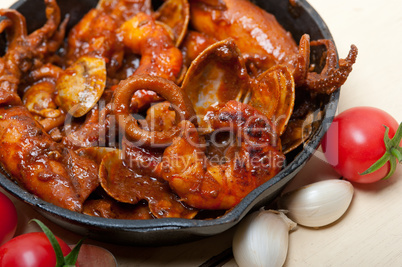 fresh seafoos stew on an iron skillet