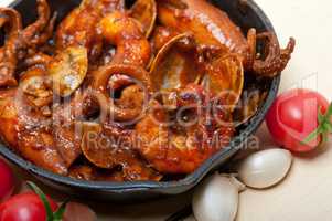 fresh seafoos stew on an iron skillet