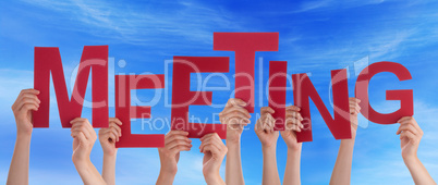Many People Hands Holding Red Word Meeting Blue Sky