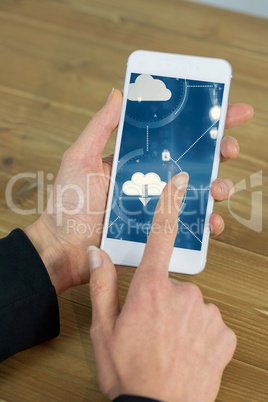 Woman using smartphone with cloud graphics