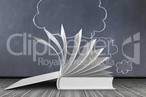 Open book against cloud on blackboard