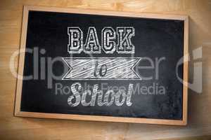 Composite image of back to school against chalkboard