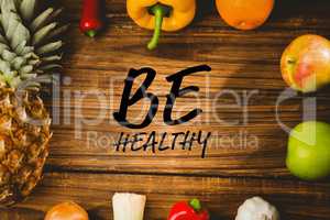 Composite image of be healthy surrounded by fruits and vegetable