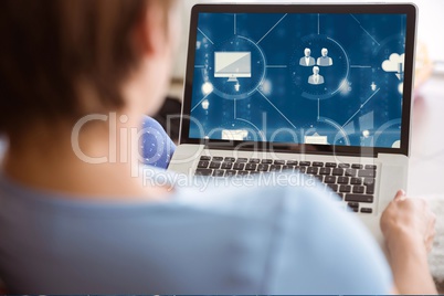 Woman using laptop with graphics