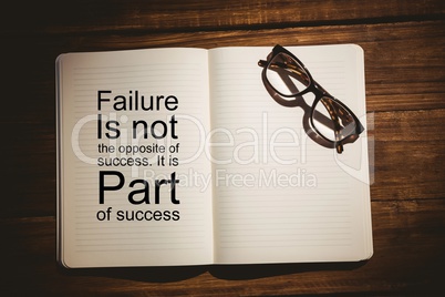 Composite image of success quote on book