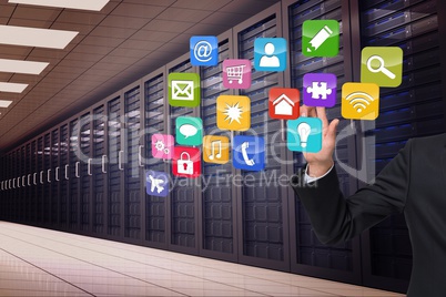 Composite image of businessman touching apps