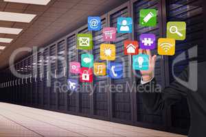 Composite image of businessman touching apps