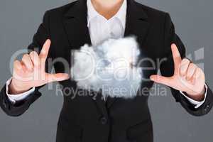 Composite image of a business man with a cloud