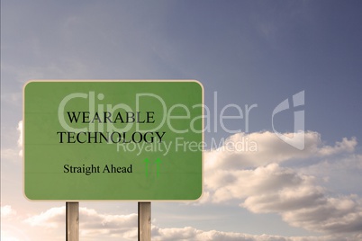 Green street sign showing wearable technology