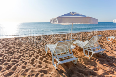 Sunbeds and sun umbrellas on the beach