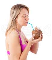 woman drinking coconut cocktail