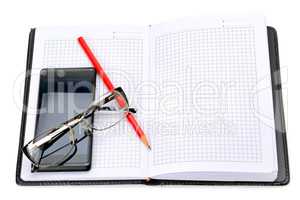 mobile phone, glasses and notebook isolated on white background