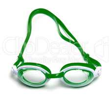 Green goggles for swimming on white