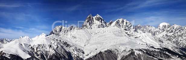 Panoramic view on Mount Ushba at wind sunny day
