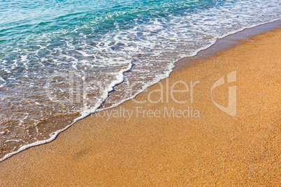 Soft wave of the sea on the sandy beach